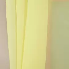 Citromsárga színű voile függöny egyedi méretre varrva